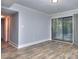 Bright living area with hardwood floors and sliding glass doors leading to the outside at 921 Creekdale Dr, Clarkston, GA 30021