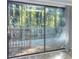 Inviting sliding glass doors open to a private balcony with natural light and scenic views at 921 Creekdale Dr, Clarkston, GA 30021
