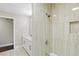 Bathroom features a tiled shower, and a modern vanity with white countertops at 3309 Poplar Dr, Lawrenceville, GA 30044