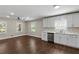 Bright kitchen features stainless steel appliances, white cabinetry, and hardwood floors creating an inviting space at 3309 Poplar Dr, Lawrenceville, GA 30044