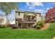 Expansive backyard with a covered deck, lush lawn, and mature trees, perfect for outdoor living and entertaining at 4155 Summit Gate Dr, Suwanee, GA 30024