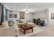 Basement area featuring a large sectional sofa, desk and bookshelves at 4155 Summit Gate Dr, Suwanee, GA 30024