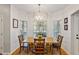 Bright breakfast nook features modern lighting, hardwood floors, and a view of the yard at 4155 Summit Gate Dr, Suwanee, GA 30024