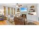 Cozy living room featuring built-in shelving, a fireplace, and comfortable seating at 4155 Summit Gate Dr, Suwanee, GA 30024