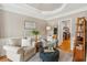 Cozy living room with hardwood floors, neutral color palette, and tray ceiling at 4155 Summit Gate Dr, Suwanee, GA 30024