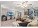 Comfortable living room featuring a large sectional sofa and a TV with an ocean view at 4155 Summit Gate Dr, Suwanee, GA 30024