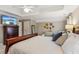 This large main bedroom features tray ceilings, a ceiling fan, and generous closet space at 4155 Summit Gate Dr, Suwanee, GA 30024