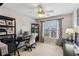 Well-lit office space with large windows, ceiling fan, and ample desk space at 4155 Summit Gate Dr, Suwanee, GA 30024