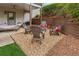 Cozy patio area featuring chairs, a small table, and decorative gravel at 4155 Summit Gate Dr, Suwanee, GA 30024