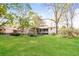 Large backyard with mature trees and a well-maintained lawn at 5798 Salem Rd, Covington, GA 30016