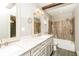 Elegant bathroom featuring double vanity, marble countertop, and tiled tub-shower at 5798 Salem Rd, Covington, GA 30016