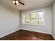 Bright bedroom with wood floors and large windows overlooking the yard at 5798 Salem Rd, Covington, GA 30016