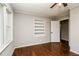 Bedroom with hardwood floors, built-in shelving, and natural light at 5798 Salem Rd, Covington, GA 30016