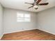 Bedroom featuring hardwood floors, a ceiling fan and a bright window at 5798 Salem Rd, Covington, GA 30016