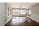 Bright dining area with large windows, hardwood floors, and stylish lighting at 5798 Salem Rd, Covington, GA 30016