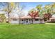 Charming single-story home with a metal roof, inviting front porch, and a lush green lawn at 5798 Salem Rd, Covington, GA 30016