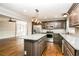 Modern kitchen featuring stainless steel appliances, granite countertops, and custom cabinets at 5798 Salem Rd, Covington, GA 30016