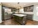 Well-lit kitchen with stainless steel appliances, granite countertops and a kitchen island at 5798 Salem Rd, Covington, GA 30016