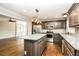 Modern kitchen with granite countertops, stainless steel appliances, and a center island at 5798 Salem Rd, Covington, GA 30016