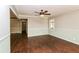 Neutral living room with hardwood floors, ceiling fan, crown molding and large window at 5798 Salem Rd, Covington, GA 30016