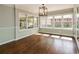 Inviting sun room featuring hardwood floors, large windows and natural light at 5798 Salem Rd, Covington, GA 30016