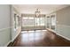 Bright sun room with hardwood floors, light-colored walls, large windows, and ample natural light at 5798 Salem Rd, Covington, GA 30016