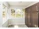 Sunroom with large windows offering abundant natural light and backyard views at 5798 Salem Rd, Covington, GA 30016