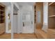 Bright bathroom features hardwood floors, closet, and white tile at 1211 Oakdale Ne Rd, Atlanta, GA 30307