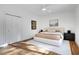 Serene bedroom featuring neutral tones, plush bedding, and hardwood floors at 1211 Oakdale Ne Rd, Atlanta, GA 30307