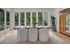 Bright dining room featuring large windows with views of outdoor greenery and hardwood floors at 1211 Oakdale Ne Rd, Atlanta, GA 30307