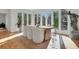 Sunlit dining room with floor-to-ceiling windows and modern furnishings at 1211 Oakdale Ne Rd, Atlanta, GA 30307