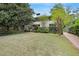 Charming front exterior with lush greenery, mature trees, and a well-manicured lawn at 1211 Oakdale Ne Rd, Atlanta, GA 30307