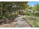 Stunning front exterior with lush landscaping and a walkway leading to the front door at 1211 Oakdale Ne Rd, Atlanta, GA 30307