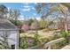 A beautiful front view of the home with a lush green lawn and trees at 1211 Oakdale Ne Rd, Atlanta, GA 30307