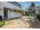 Spacious two-car garage with a driveway and well-maintained landscaping, adding curb appeal to the property at 1211 Oakdale Ne Rd, Atlanta, GA 30307