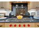 Close up of a modern gas stovetop and granite countertops with cabinets at 1211 Oakdale Ne Rd, Atlanta, GA 30307