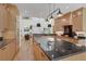 Modern kitchen with granite countertops, an island, stainless steel appliances, and hardwood floors at 1211 Oakdale Ne Rd, Atlanta, GA 30307