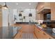 Modern kitchen features light wood cabinetry, dark countertops, and high-end appliances at 1211 Oakdale Ne Rd, Atlanta, GA 30307