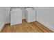 Featuring a modern washer and dryer in a dedicated laundry space with hardwood floors at 1211 Oakdale Ne Rd, Atlanta, GA 30307
