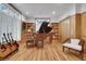 Music room showcasing a grand piano, custom built-ins, and guitar display at 1211 Oakdale Ne Rd, Atlanta, GA 30307