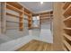 Walk-in closet with natural wood shelves and organizers at 1211 Oakdale Ne Rd, Atlanta, GA 30307