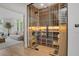 Custom wine cellar with extensive racking, glass doors, and elegant lighting at 1211 Oakdale Ne Rd, Atlanta, GA 30307