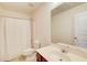 Clean bathroom with a shower and tub combination, featuring a single sink vanity and neutral tile at 1250 Edgebrook Ln, Snellville, GA 30078
