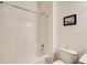Cozy bathroom with tiled shower-tub, neutral walls, and modern fixtures at 1250 Edgebrook Ln, Snellville, GA 30078
