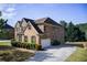 Beautiful two-story brick home with a well-manicured lawn and attached garage, providing curb appeal at 1250 Edgebrook Ln, Snellville, GA 30078