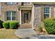 Inviting front entrance features a classic door, brick steps, and manicured landscaping at 1250 Edgebrook Ln, Snellville, GA 30078