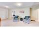 Inviting living room with comfortable armchairs, artwork, and doorways to other rooms at 1250 Edgebrook Ln, Snellville, GA 30078