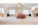 Expansive main bedroom with tray ceilings, large windows, and a view of the en-suite bathroom at 1250 Edgebrook Ln, Snellville, GA 30078