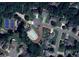 Aerial view showcasing the community pool, tennis courts, and surrounding homes in a lush, green neighborhood at 2004 Westover Nw Ln, Kennesaw, GA 30152