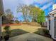 A well-manicured backyard with lush green grass and a patio, perfect for outdoor relaxation and entertaining at 2004 Westover Nw Ln, Kennesaw, GA 30152